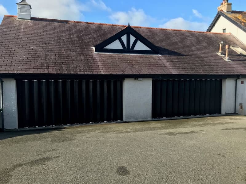 Ram-Fold Folding Shutter Doors Specified for Residential Garage in Anglesey. Ram-Fold Folding Shutter Doors Specified for Residential Garage in Anglesey.