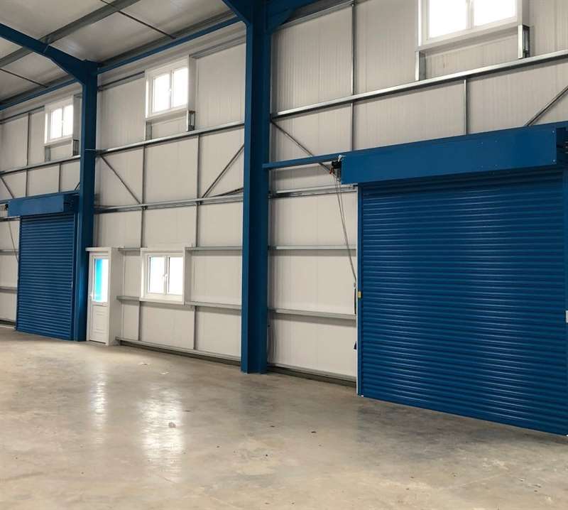 2 alliance door S11DD industrial roller shutters in a warehouse